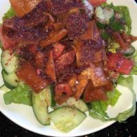 Fattoush Salad · Traditional salad mixed with fried pita.