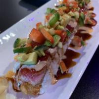 Cyndi Lauper Roll · Shrimp tempura, spicy tuna and cream cheese. Topped with seared red tuna, strawberries, avoc...