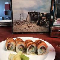 Journey Roll · Red tuna, crab  meat and cucumbers. Topped with fresh salmon, orange slices, ponzu, sweet ch...