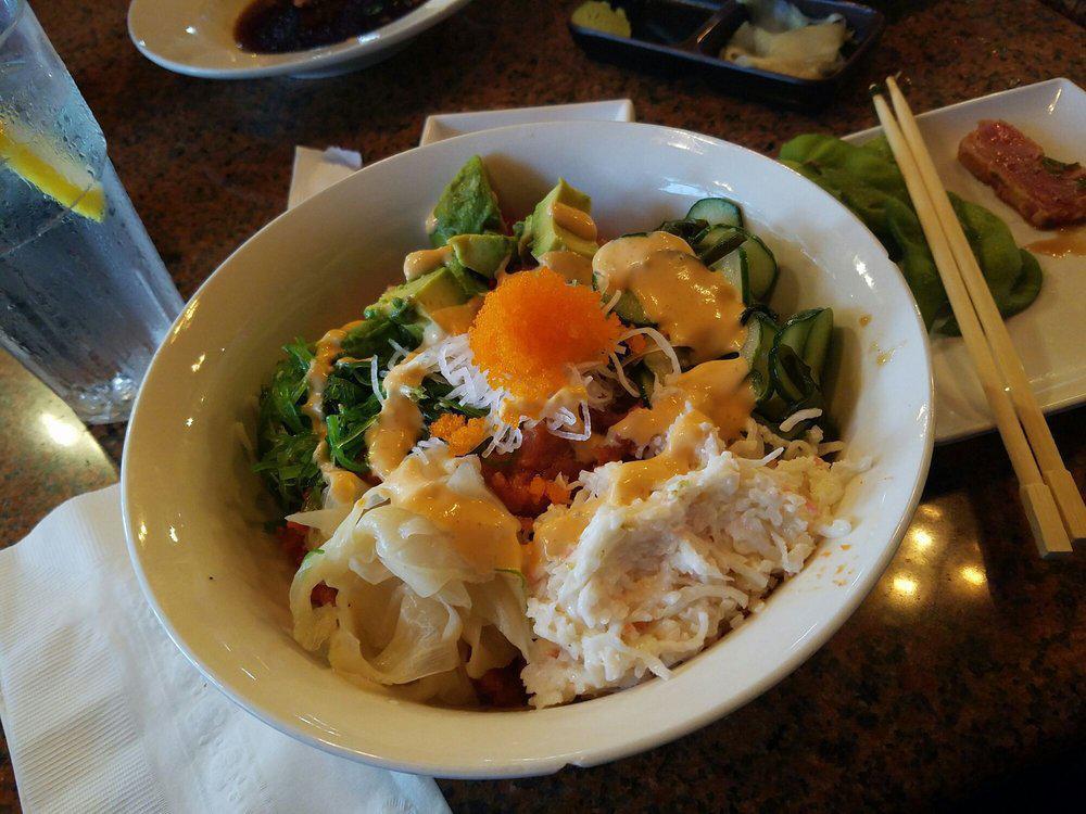 Poke Bowl · Served w/ white rice or Salad. Make it w/ brown rice for an additional charge. Comes with 3 kinds of your favorite proteins (tuna, salmon, albacore, octopus, spicy scallops or spicy tuna) Topped with krab, radish, crispy jalapeno,  cucumber & seaweed, masago, avocado & spicy mayo or creamy goma sauce.