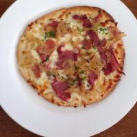 Laurel Heights Pizza · Prosciutto di parma, mozzarella, caramelized onions, honey, arugula.