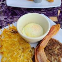 French Toast · Thick egg bread, dipped in our special batter, grilled golden brown, topped with powdered su...