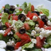 Greek Salad · Romaine lettuce, tomatoes, cucumber, red onions, feta cheese and kalamata olives.