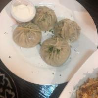Manti · 4 pieces. Steamed dumplings with chopped beef and onions served with kefir cheese.