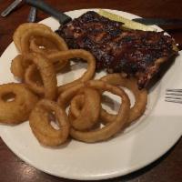 Isabelle's Fall Off the Bone Baby Back Ribs · Victoria's golden ale marinated ribs basted in our house-made BBQ sauce and served with frie...