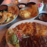 Carne Asada · Steak marinated in special seasonings and grilled to your liking. Served with Mexican rice, ...