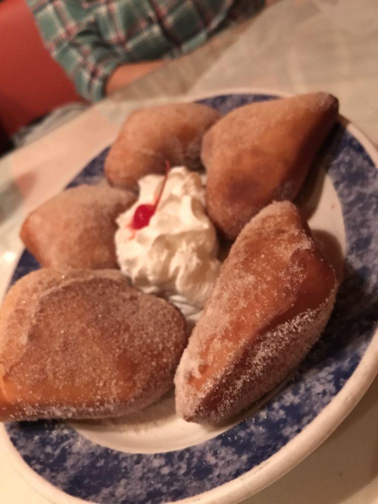 Sopapillas · Lightly fried pastries sweetened with sugar and cinnamon. Served with whipped cream, honey and a cherry.