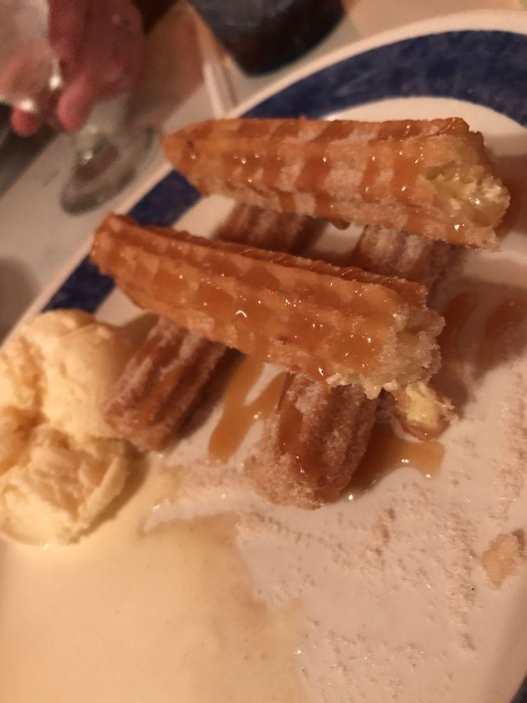 Churros · A Mexican classic deep-fried pastry stuffed with Bavarian cream then sweetened with cinnamon and sugar, Served with ice cream, caramel sauce, and cherry.