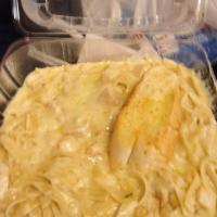 Grilled Chicken Alfredo · Flattop grilled chicken breast swimming in a pool of creamy 3 cheese sizzlin Alfredo sauce o...