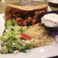 Chicken Souvlaki · Served with rice pilaf, Greek salad and french fries.