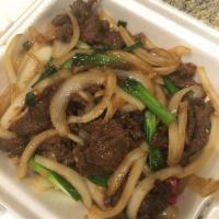 Mongolian Beef · Comes with brown sauce and vegetables. Hot and spicy. 