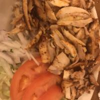 Chicken Gyro · Layers of marinated chicken breast wrapped around the large vertical spit and grilled in fro...