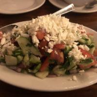 Shepherd Salad · Fresh tomatoes, cucumbers, onions and parsley seasoned with our special blend of oil and vin...