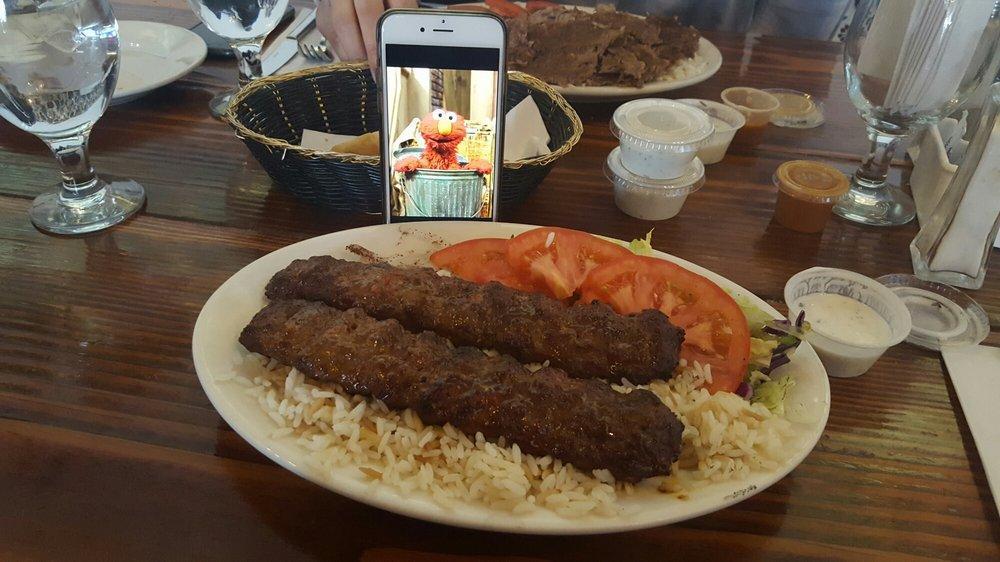 Adana Kebab · Hand chopped meat seasoned with spice and red pepper and grilled on skewers.