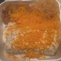 Shredded Chicken Chimichanga · Fried burrito with shredded chicken (onions, tomato, bell peppers) beans, cheese inside topp...