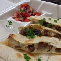 Quesadillas · Large flour tortilla with cheese and your choice of protein (chicken or beef) with pico de G...