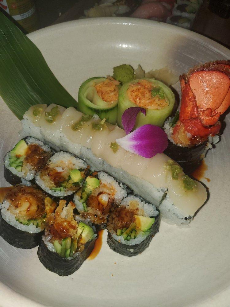Amazing Roll · 8 pieces. Yellowtail, tuna, salmon, jalapeno, avocado inside, topped with fresh scallop and wasabi sasa.