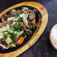 Bulgogi · Served with steamed rice, miso soup, and sides (banchan).