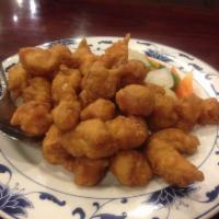 Sweet and Sour Chicken · Deep-fried crispy chicken cooked with bell peppers, carrots, white onion, and pineapple in s...