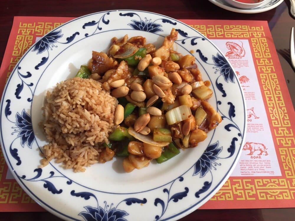 Kung Pao Chicken · Sliced chicken cooked with white onions, water chestnuts, bell peppers, and celery topped with peanuts in spicy Kung Pao sauce. Hot and spicy.