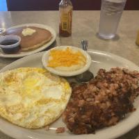 Corned Beef Hash and Eggs · 3 farm fresh eggs cooked your way.
