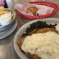 Chicken Fried Chicken · Breaded in our kitchen and topped with cream gravy.