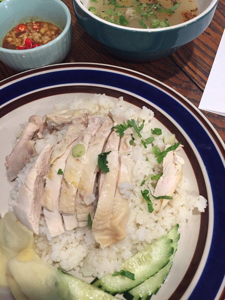 Khao Mun Gai · Steamed chicken over ginger rice, cucumber served with fermented soy bean sauce and chicken soup on the side.