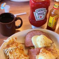 Eggs Benedict · 2 poached eggs and smoked ham over a toasted English muffin, topped with hollandaise sauce. ...