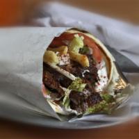 Lamb Gyro · Lamb gyro with lettuce, tomatoes, onions and tzatziki wrapped in pita bread.