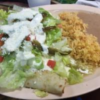 Enchiladas Verdes · Chicken enchiladas. With green sauce topped with melted cheese.