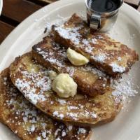 French Toast · Homemade bread, dipped in cream and beaten eggs, grilled rich golden brown and sprinkled wit...