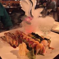 Sex on the Beach Roll · Spicy tuna and shrimp tempura topped with super white tuna, avocado and caviar, eel sauce an...
