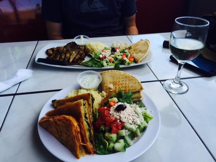 Pork Chops · 2 Grilled, marinated pork chops. Choice of 2 side dishes: Greek salad, rice pilaf, fries or black beans; with pita bread and tzatziki sauce. 