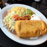 1 Big Chimichanga · Choice of chicken, pork, chunky beef or ground beef with cheese, Served with sour cream and ...
