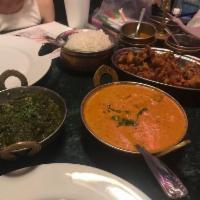 Saag Paneer · Spinach cooked with cream, homemade cheese, herbs and spices. Served with basmati rice and y...