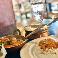 Butter Chicken · Diced tandoori chicken leg meat cooked with creamy tomato and onion sauce. Served with basma...