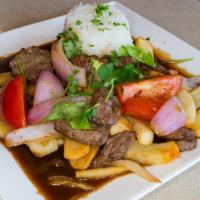 Lomo Saltado · Our popular traditional Peruvian dish. Tender steak, sauteed with onions, tomatoes and soy s...