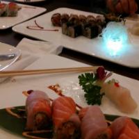 Kuma Kuchi Roll · Raw. In: spicy scallop, king crab with crunch. Out: yellowtail, salmon, tobiko, eel and spic...
