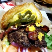 Grilled Jalapeno Bacon Cheeser Burger · Garlic aioli, lettuce, tomato, onion, fresh grilled jalapenos, bacon and American cheese. Fr...