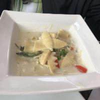 Green Curry · Bamboo shoots, bell peppers, peas, carrots, basil leaves in green curry sauce. curry entree ...
