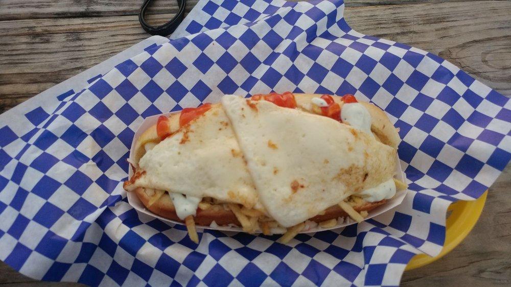 Venezuelan Hot Dog · Beef hot dog in a warm bun with coleslaw, potato stix, mayo, ketchup, kourmet sauce and Parmesan cheese.