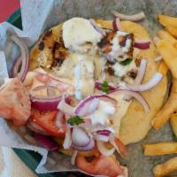 Chicken Kabob Sandwich · Charbroiled marinated chicken breast pieces served on a pita with onions, tomatoes and tzatz...