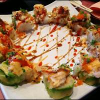 Sushi On Fire Roll · Shrimp tempura, shrimp salad, and avocado wrapped in soy paper, topped with baked langostino...