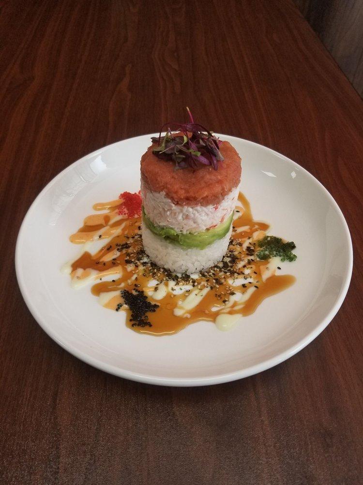 Ahi Tower · Comprised layer of sushi rice crabmeat, avocado, tobiko and spicy tuna.