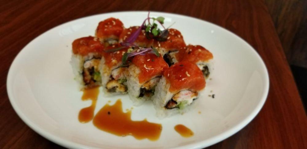 Fire Dragon Roll · Eel, crabmeat, cucumber, avocado, cream cheese topped with spicy tuna and eel sauce.