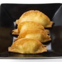 Crab Rangoon · Crab and cream cheese wontons served with house-made sweet & sour sauce.