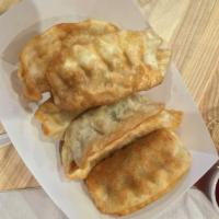 Chicken Potstickers · Chicken & veggies folded in a dumpling. Dip it in our house-made Gyoza sauce.