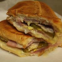 Cuban Sandwich · Ham, cheese, pork and pickles served on Cuban bread.