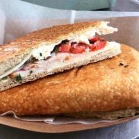 Turkey Supreme Panini · Turkey, tomatoes, basil, red onions, feta & mozzarella cheese. Served with our Mustard Dijon...