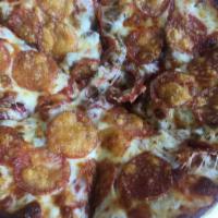 Exciting Italian Pizza · Big Tomato sauce, Italian sausage, pepperoni, mozzarella & parmesan cheese.